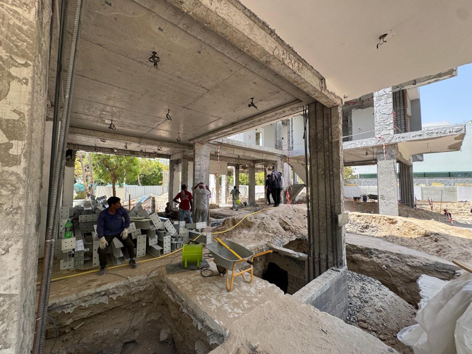 Inside the reinforced concrete frame of Nest A22, open to the garden, August 2026