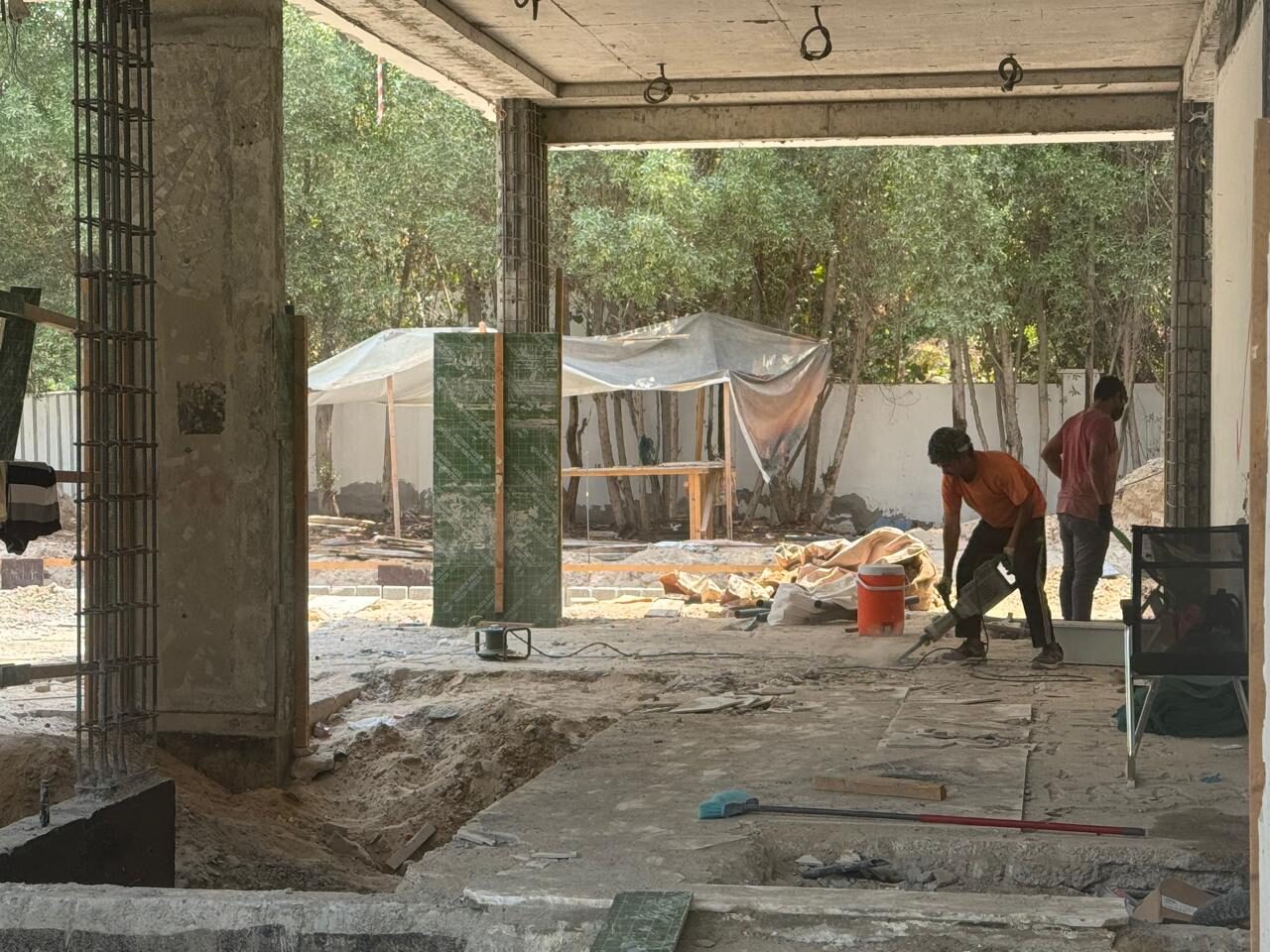 Marble delivered and staged inside the concrete frame of Nest A22, September 2026